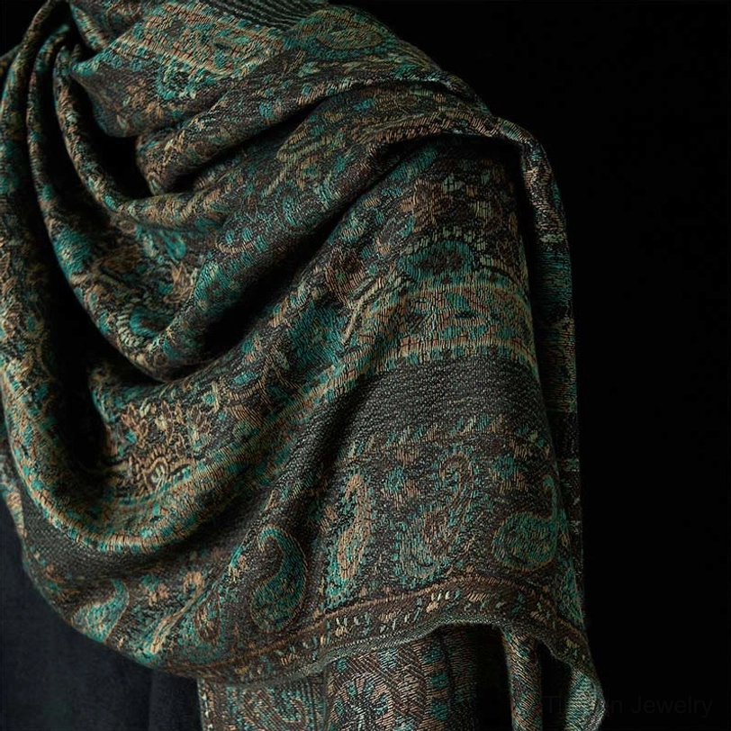 Close-up of Tibetan paisley shawl texture, intricate woven geometric pattern in dark retro tones