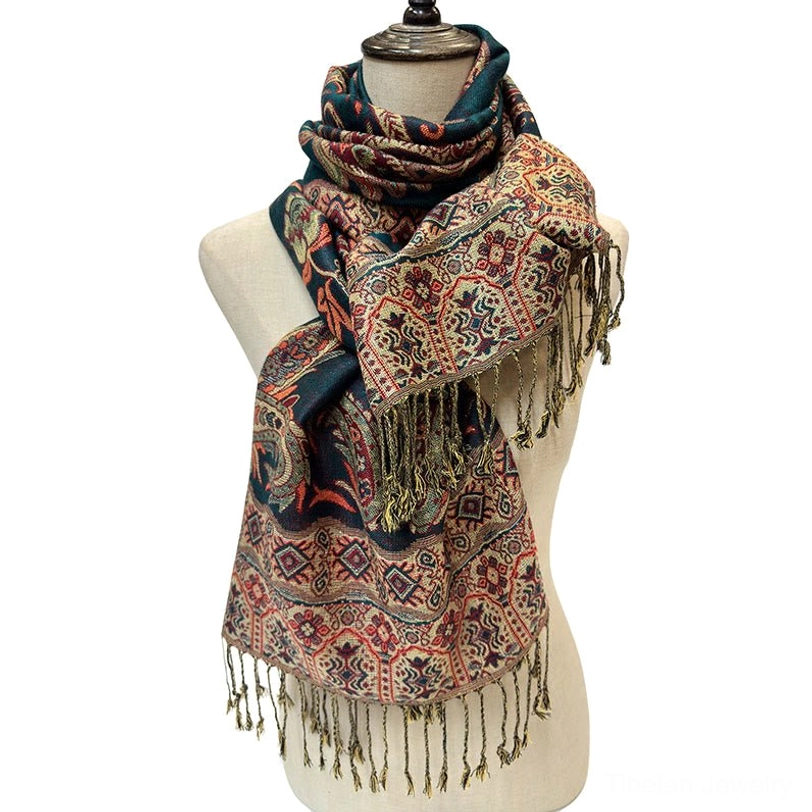 Bohemian paisley tassel scarf wrapped styled view on dress form with multi-color woven paisley pattern and fringe