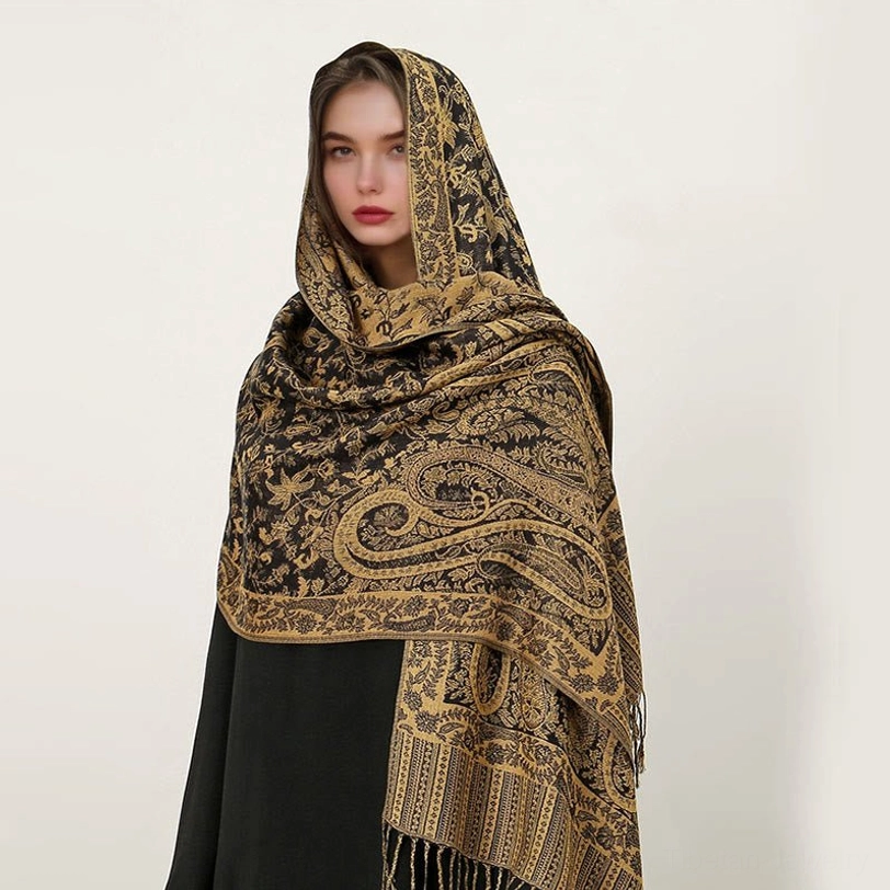 Tibetan paisley shawl styled as evening wrap showing versatile draping and elegant ethnic patterns