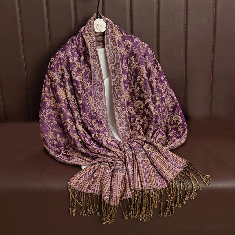 Tibetan ethnic paisley shawl styled for formal events showing sophisticated draping and elegant patterns