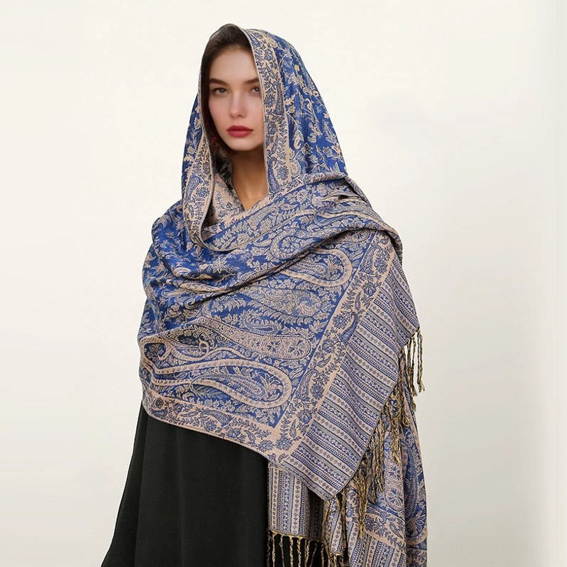 Tibetan handcrafted paisley shawl showing full length drape and jacquard pattern texture with tassels