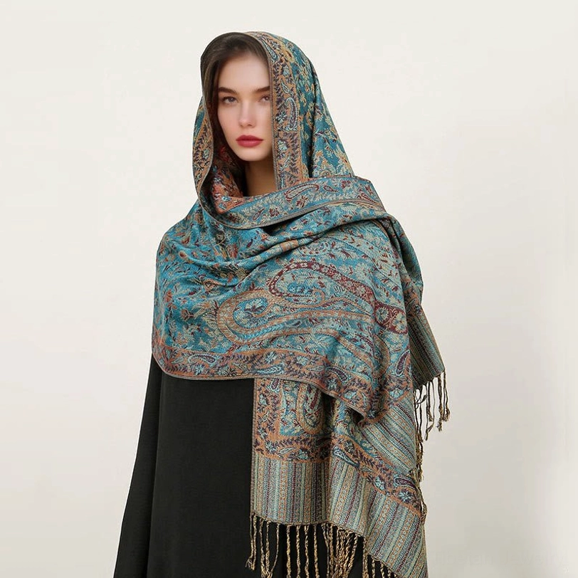 Light sea green Tibetan paisley shawl with jacquard patterns styled as elegant evening wrap