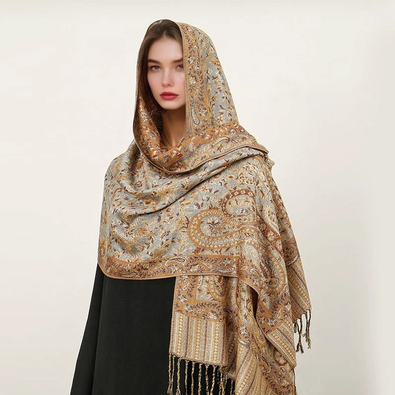 Pale turquoise Tibetan paisley shawl with golden jacquard patterns and handcrafted tassel hem