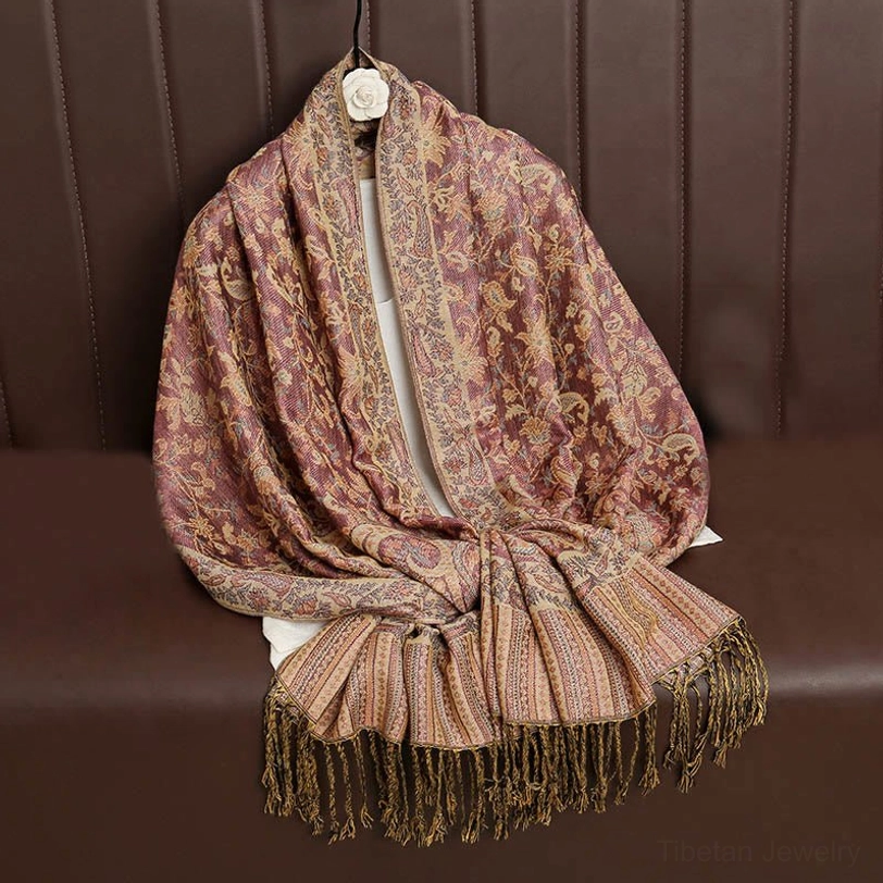 Pale turquoise Tibetan ethnic paisley shawl with traditional jacquard weaving and cultural meaning