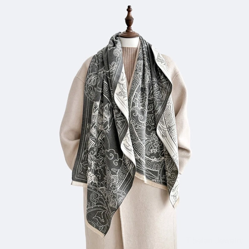 Reversible Tibetan-inspired scarf shawl draped loose on mannequin showing dual-tone edge finish and pavilion wave patterns