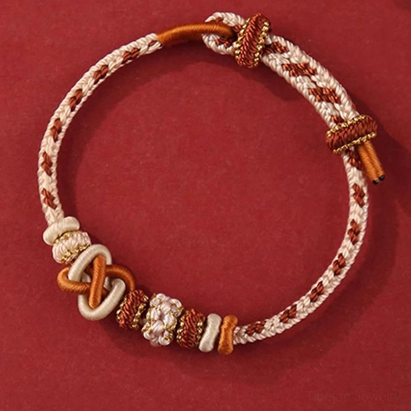 Tibetan handcrafted blessing bracelet collection showing multiple color variations including red, blue, pink and earth tones