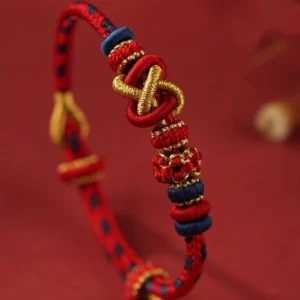 Close-up detail of handwoven peace knot bracelet showing twisted central knot design and color variations