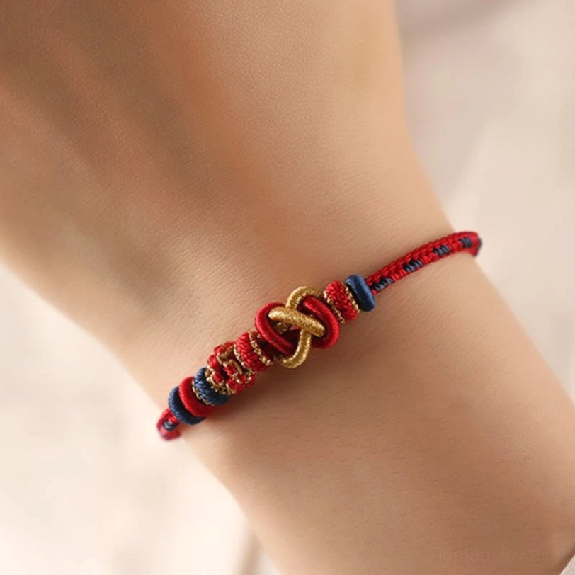 Tibetan blessing bracelet worn on wrist showing adjustable fit and real-life styling with red and gold threads