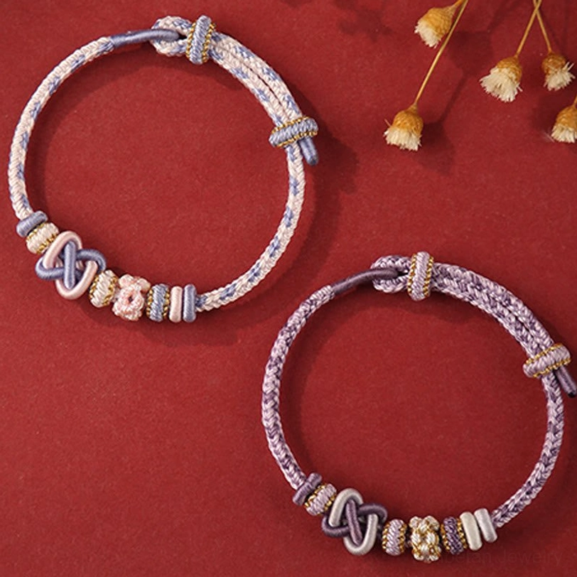 Close-up texture detail of handwoven tibetan peace knot bracelet showing natural string material and artisan craftsmanship