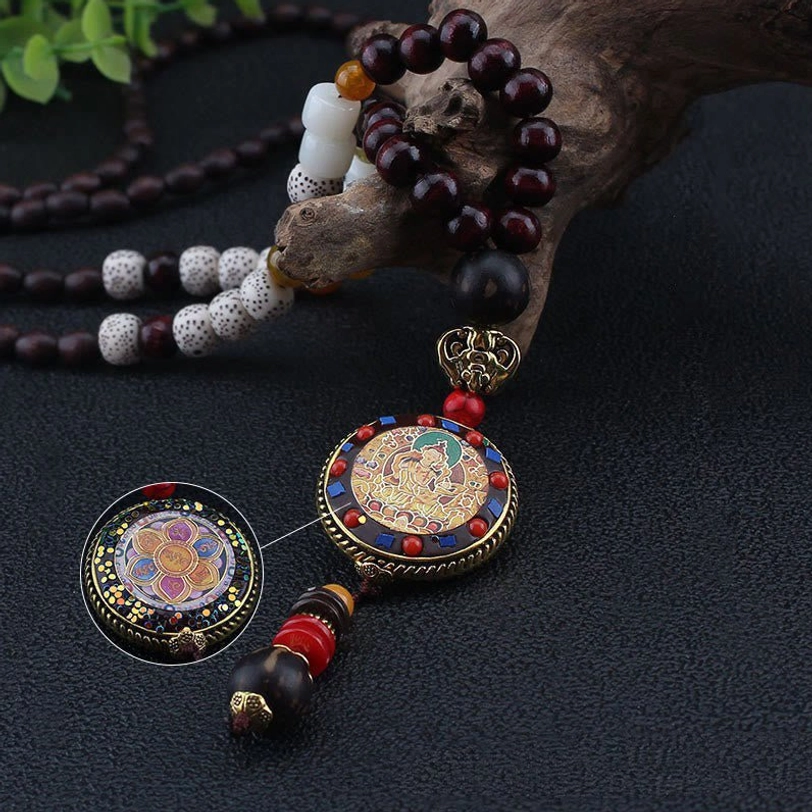 Tibetan Om Mani Padme Hum necklace pendant front and back view showing enamel design