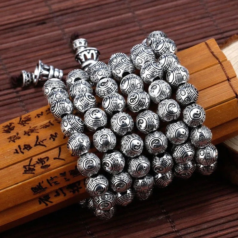 Stacked Tibetan Pixiu beaded bracelets with antique silver finish and metal clasp fasteners