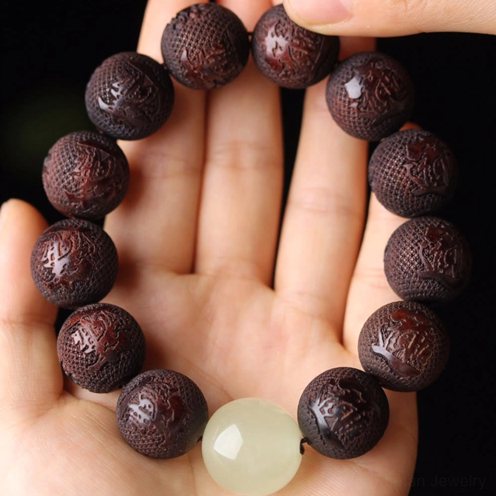 Tibetan rosewood Pixiu prosperity bracelet lifestyle wear showing elastic band fit