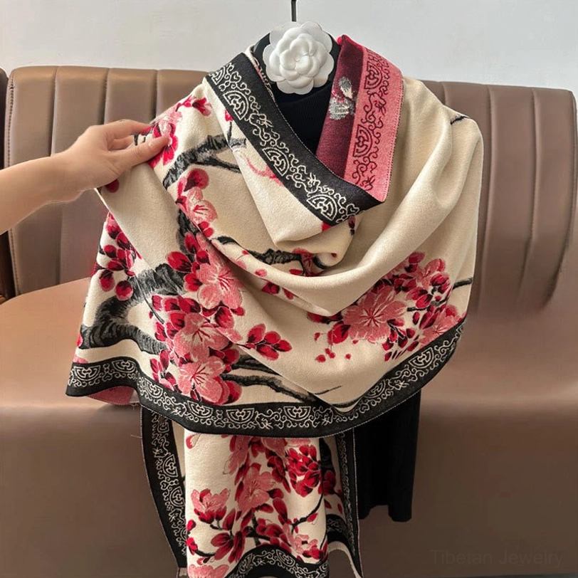 Beige plum blossom Tibetan scarf close-up on mannequin showing dual decorative borders and reversed floral pattern detail