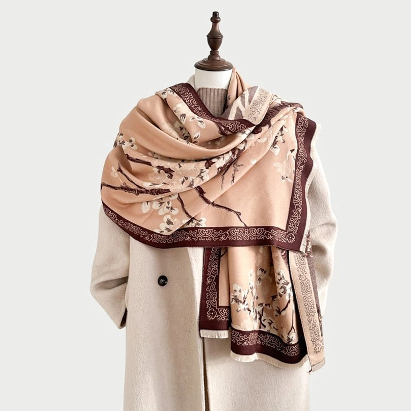 Handcrafted Tibetan plum blossom scarf detail showing vintage border pattern, artisanal weaving, and quality construction
