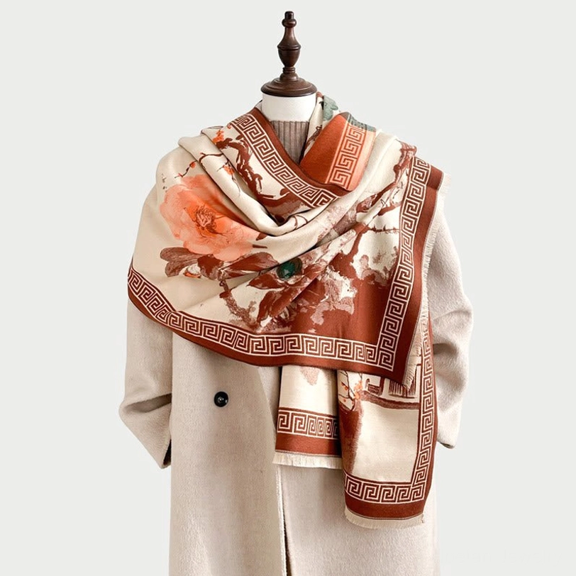 Tibetan plum blossom ink painting scarf in warm tones, styled on mannequin showcasing beige base with orange floral and pavilion print detail