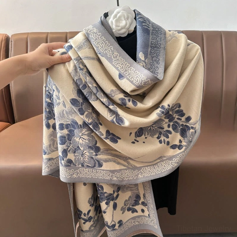 Peach puff Tibetan plum blossom scarf showcasing soft pastel base with delicate floral print and decorative fringe