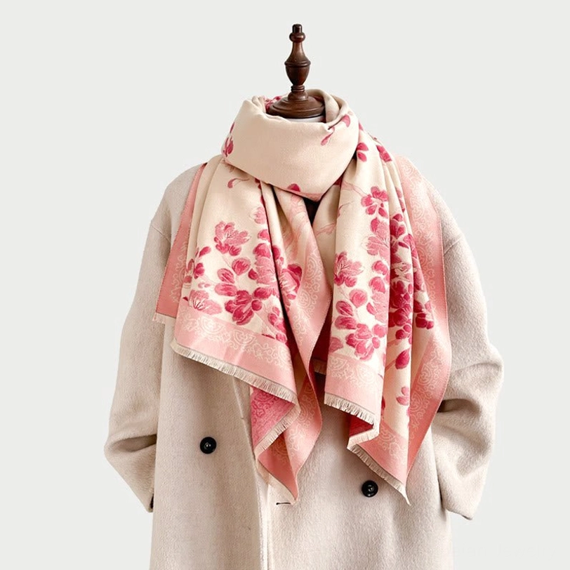 Light pink Tibetan plum blossom scarf wrapped on mannequin in shoulder styling with plain studio background