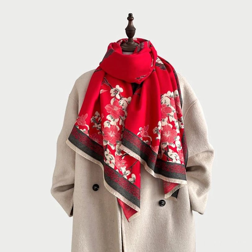 Red plum blossom Tibetan scarf draped around shoulders on mannequin showing styling and wrap technique