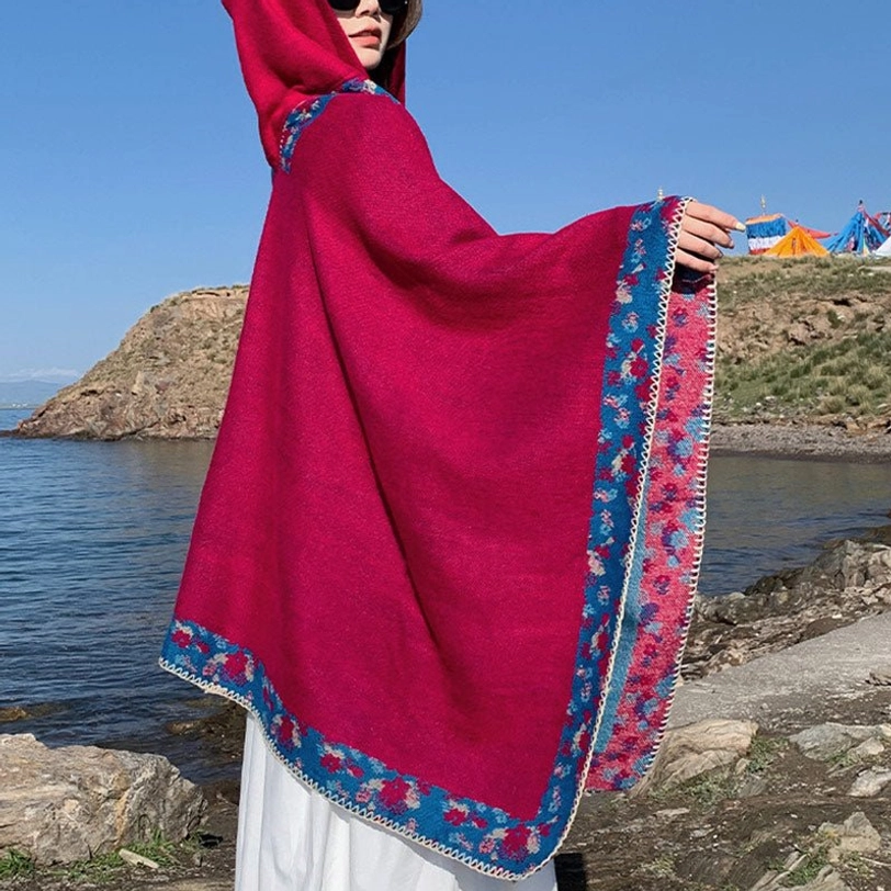 Tibetan wrap poncho styled with festival fashion and bohemian accessories for eclectic look