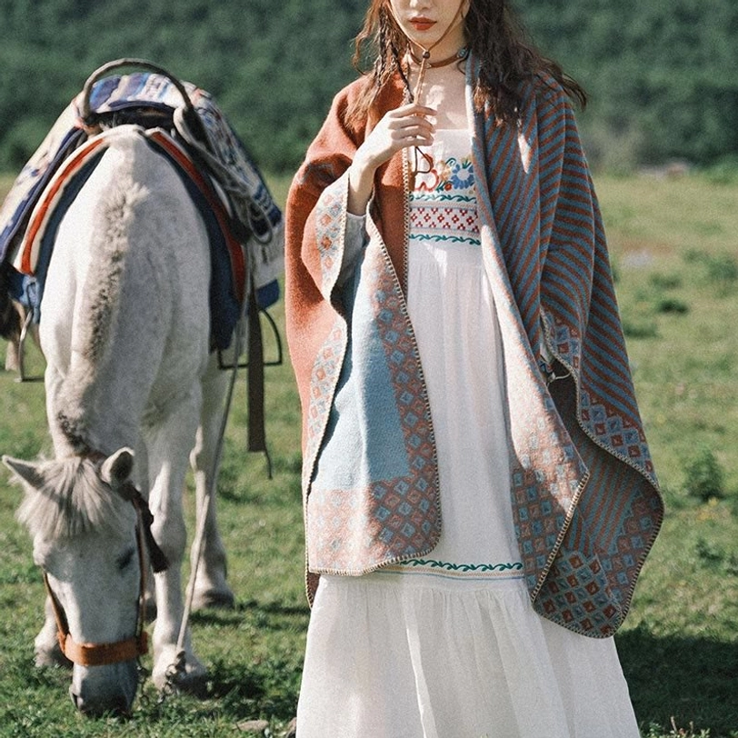 Tibetan striped ethnic poncho styled with matching accessories showing complete cultural aesthetic presentation