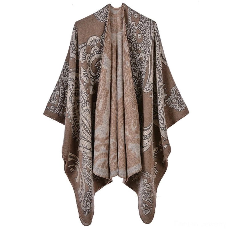 Tibetan paisley poncho wrap in dark khaki, full front view on model wearing oversized poncho style