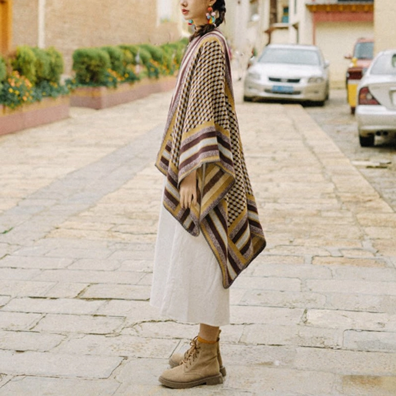 Tibetan poncho shawl worn as elegant evening wrap, demonstrating formal occasion styling