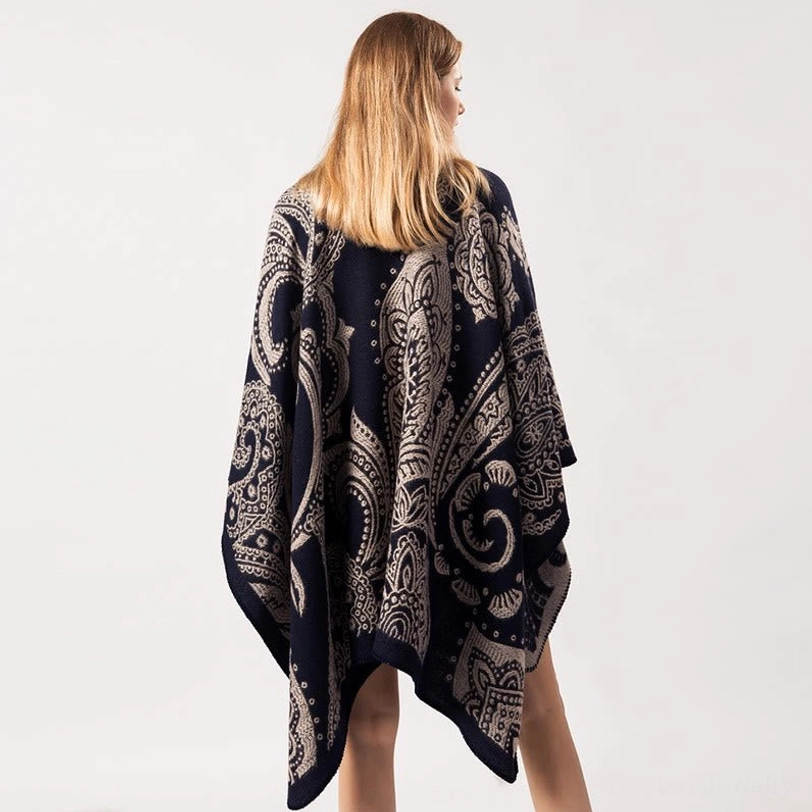 Tibetan paisley poncho back view, full rear perspective on model showing decorative pattern and open-front design