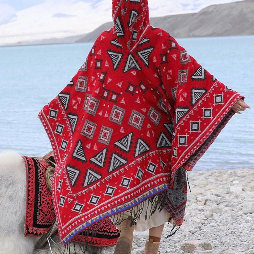 Tibetan hooded poncho cloak detail shot showing geometric pattern weave and fringed hem construction