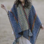 Tibetan ethnic knit poncho shawl with blue color, front view showing chevron weave pattern and contrast trim