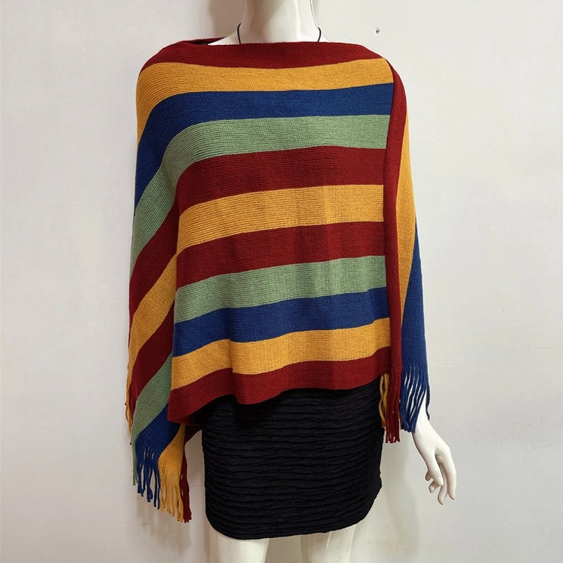 Tibetan striped poncho shawl draped over sofa showing home comfort and cozy interior decoration use