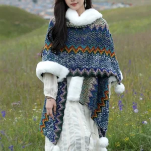 Tibetan knitted poncho shawl with multicolor wavy stripes and white faux fur collar, front view on model in outdoor grassland