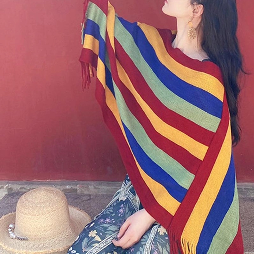 Tibetan poncho shawl paired with winter coat demonstrating warmth and fashion-forward styling combination