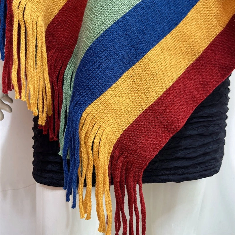Tibetan striped poncho shawl worn in yoga or wellness studio setting demonstrating spiritual lifestyle connection