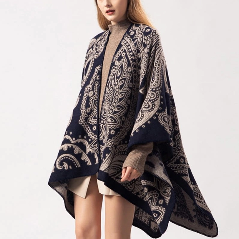 Tibetan poncho wrap with navy taupe paisley design, three-quarter front view showcasing drape and fabric texture
