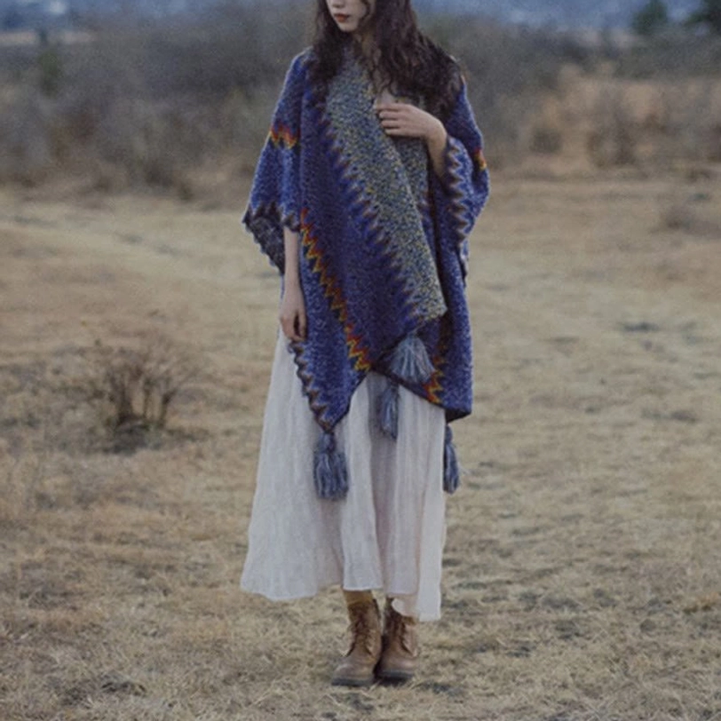 Travel styling of Tibetan ethnic poncho shawl packed compact as portable wrap for journey