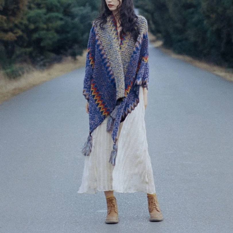 Tibetan poncho shawl worn as draped shoulder wrap showing authentic ethnic textile craftsmanship