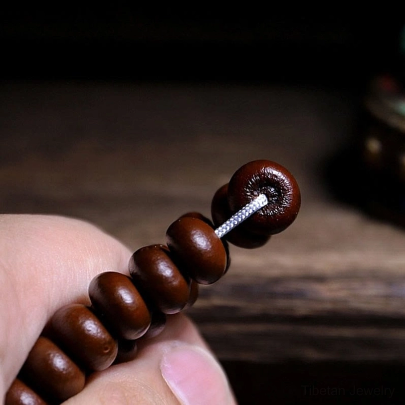 Tibetan prayer bead mala featuring bodhi seeds with spiritual significance and protective symbolism