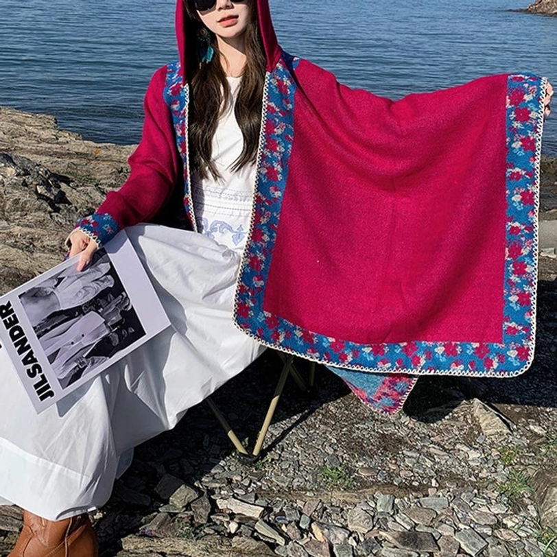 Tibetan floral trim prayer cloak worn as cozy home throw blanket on sofa or armchair