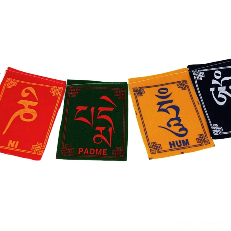 Authentic hand-printed Tibetan prayer flags showing traditional five-element colors and Buddhist iconography