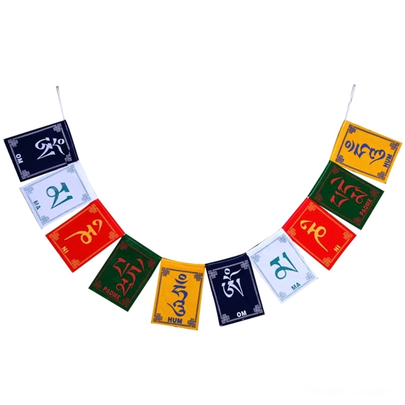 Tibetan prayer flag close-up showing detailed Tibetan script mantras and sacred symbols on fabric