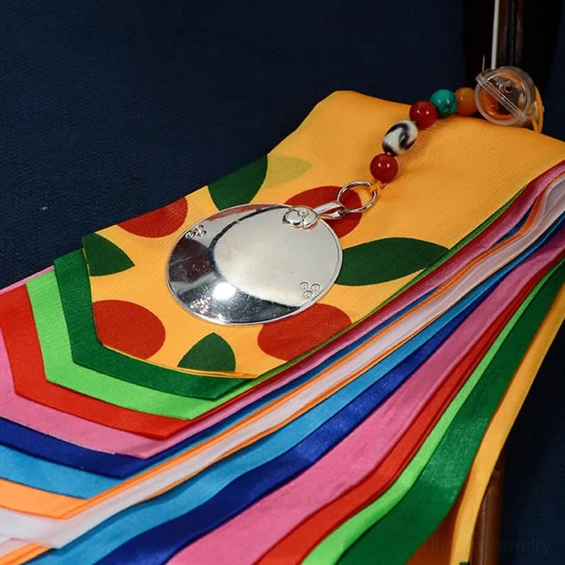 Tibetan lucky prayer flag with decorative silver round mirror ornament, multi-color satin ribbons and beaded hanging decoration