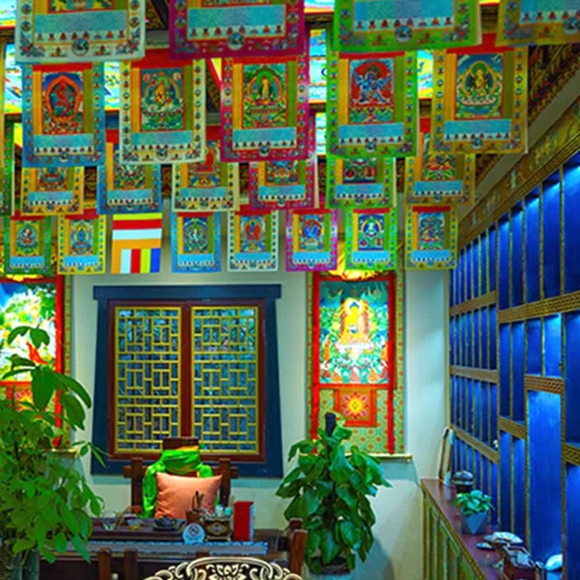 Colorful Tibetan prayer flag with traditional design elements representing spiritual elevation and positive intention