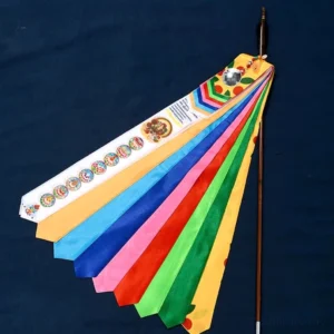 Unfolded Tibetan prayer flag with multi-color satin ribbons printed with Buddhist sutras and religious patterns on dark blue background