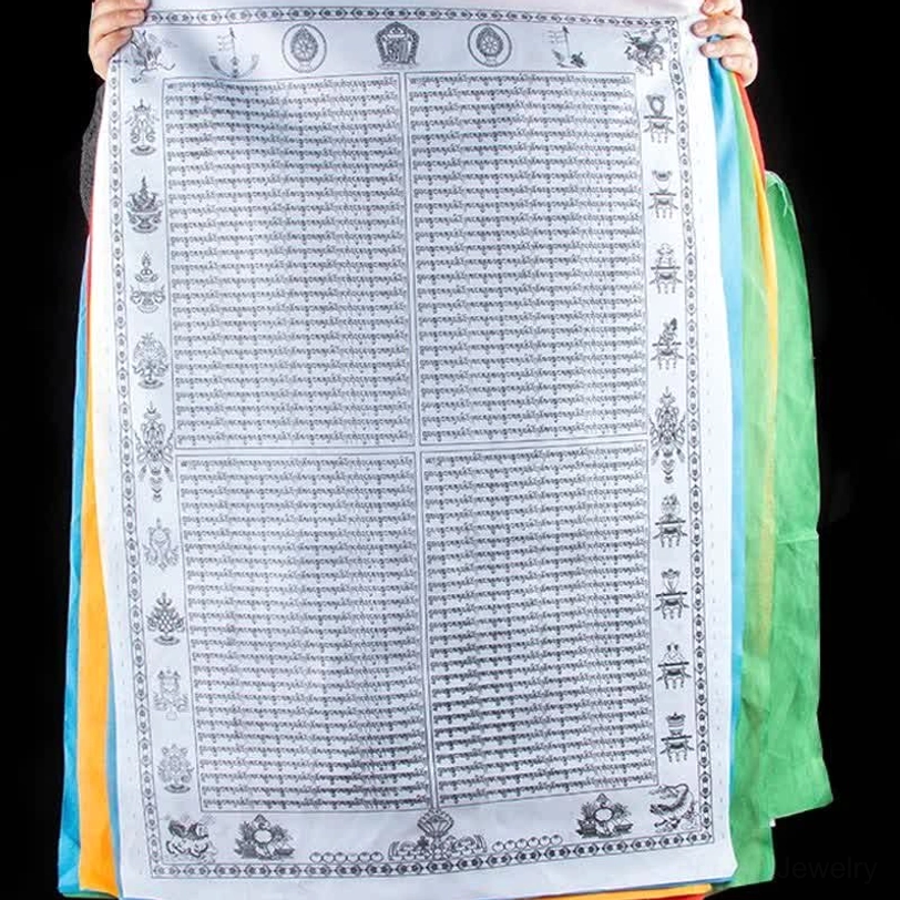 Tibetan prayer flag with white background held up featuring full black printed Tibetan mantras and decorative religious border motifs with multi-color edges