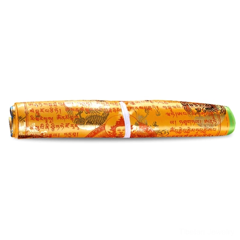 Tibetan prayer flags showing yellow earth element color with gold foil printed buddhist mantras and symbolic designs on warm yellow fabric