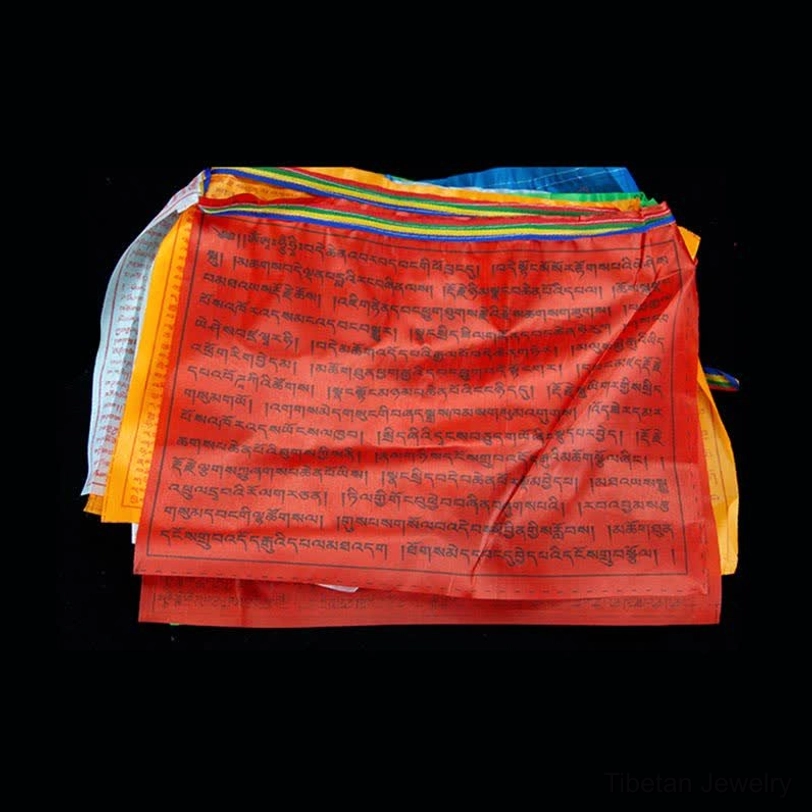Tibetan prayer flags outdoor garden installation creating peaceful spiritual atmosphere with flowing wind energy