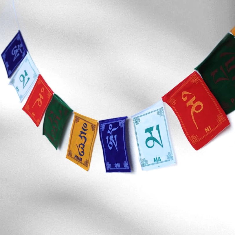 Authentic handcrafted Tibetan prayer flags featuring Om Mani Padme Hum sacred mantra printed on colorful fabric, traditional Buddhist blessings