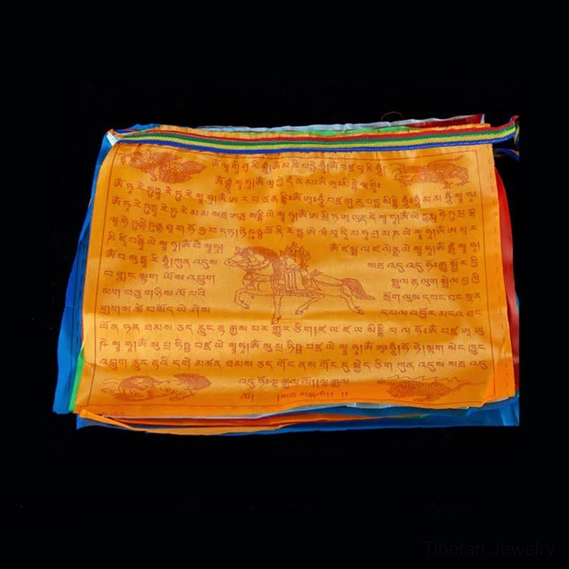 Stacked Tibetan prayer flags showing layered view of printed scriptures and windhorse motif with multi-color borders