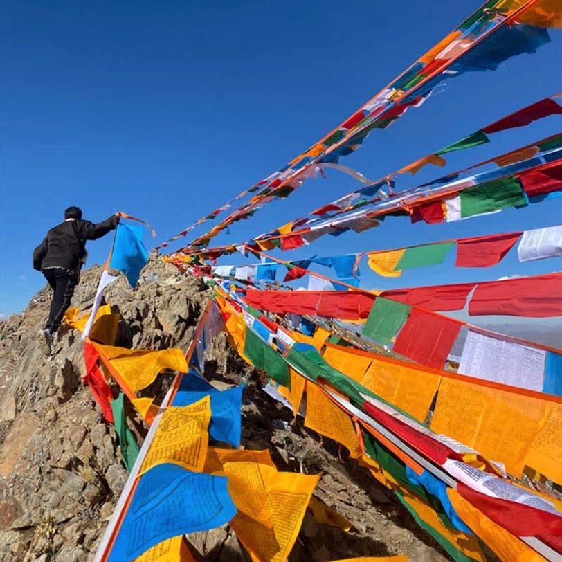 Tibetan windhorse prayer flags temple grounds community meditation gathering space sacred