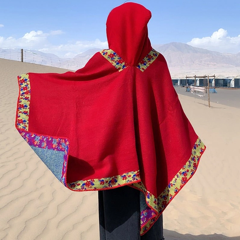 Tibetan prayer poncho detail of floral embroidery showing intricate botanical patterns and craftsmanship